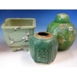 A CHINESE GREEN GROUND JAR AND COVER MOULDED IN RELIEF AND PAINTED WITH A CRANE AMONGST LOTUS. H