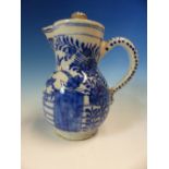 AN 18th C. DUTCH DELFT BLUE AND WHITE JUG AND COVER PAINTED WITH TWO GARDEN SCENES EITHER SIDE OF