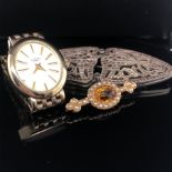AN EDWARDIAN GOLD, SEED PEARL AND CITRINE BAR BROOCH, TOGETHER WITH A MARCASITE BROOCH AND DRESS