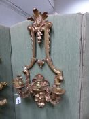 A PAIR OF FRENCH STYLE GILT BRONZE FOUR BRANCH WALL LIGHTS, THE NOZZLES ON ARMS SCROLLING BAROQUE