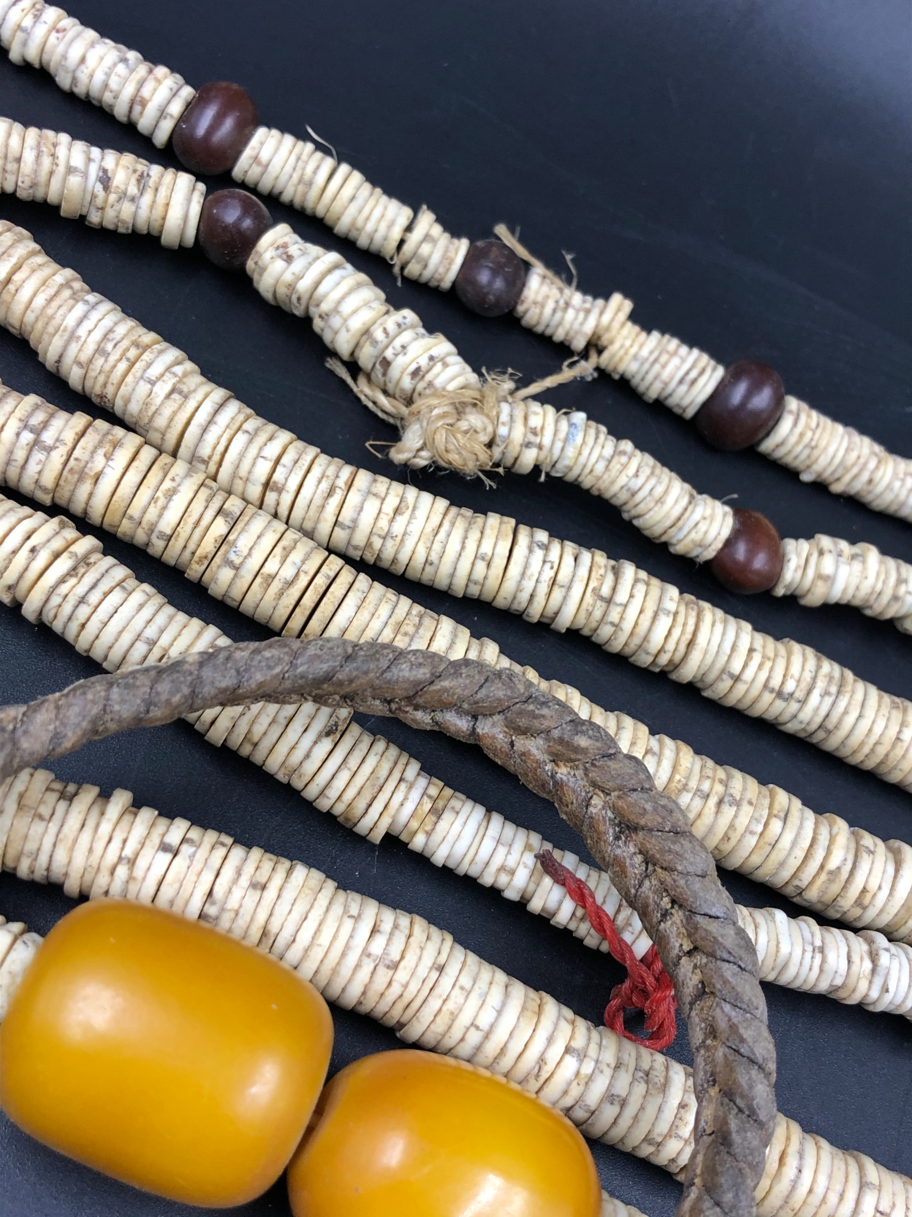 NINE STRANDS OF ETHNIC BEADED NECKLETS TO INCLUDE AMBER, BONE, IRON ETC. - Image 13 of 15