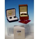 TWO PAIRS OF CASED CUFFLINKS CELEBRATING THE FLYING SCOTSMAN AND THE ROYAL SYDNEY YACHT SQUADRON