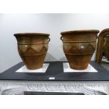 A PAIR OF TERRACOTTA TWIN HANDLE BALUSTER FORM GARDEN PLANTERS WITH INCISED DECORATION. H. 56 x