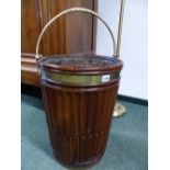 A PAIR OF GEORGIAN STYLE MAHOGANY PEAT BUCKETS AND LINERS, EACH OVERSWUNG BY BRASS HANDLES, THE