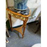 A PAIR OF FRENCH STYLE VARIEGATED BLACK MARBLE TOPPED TRIANGULAR TABLES WITH GILT WHITE APRONS AND