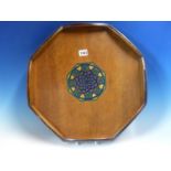 AN ART DECO MAHOGANY OCTAGONAL TRAY, THE TWO TONES OF BLUE PAINTED ON THE ROUND ARCHES OF THE