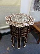 AN ISLAMIC HEXAGONAL TABLE GEOMETRICALLY INLAID IN BONE AND MOTHER OF PEARL. H. 50cms.