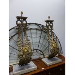 A PAIR OF TALL TABLE LAMPS, THE S-SCROLL GILT IRON FRONTS CAST WITH FOLIATE INTERLINKED C-SCROLL