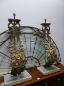 A PAIR OF TALL TABLE LAMPS, THE S-SCROLL GILT IRON FRONTS CAST WITH FOLIATE INTERLINKED C-SCROLL