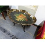 A BLACK PAPIER MACHE QUATREFOIL TRAY TOPPED COFFEE TABLE PAINTED WITH AN URN OF FLOWERS WITHIN A