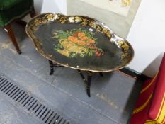 A BLACK PAPIER MACHE QUATREFOIL TRAY TOPPED COFFEE TABLE PAINTED WITH AN URN OF FLOWERS WITHIN A