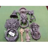 FOUR IRON AND TWO BRASS DOOR KNOCKERS TOGETHER WITH A RAMS HEAD MOUNT AND AN IRON DOOR STOP