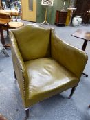 A GREEN LEATHER COVERED ARMCHAIR, THE SERPENTINE TOP RAIL AND ARM TOPS CLOSE NAILED, THE SQUARE