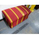 AN OTTOMAN UPHOLSTERED IN YELLOW STRIPED WINE RED ABOVE CASTER FEET. W 91 x D 51 x H 51cms.