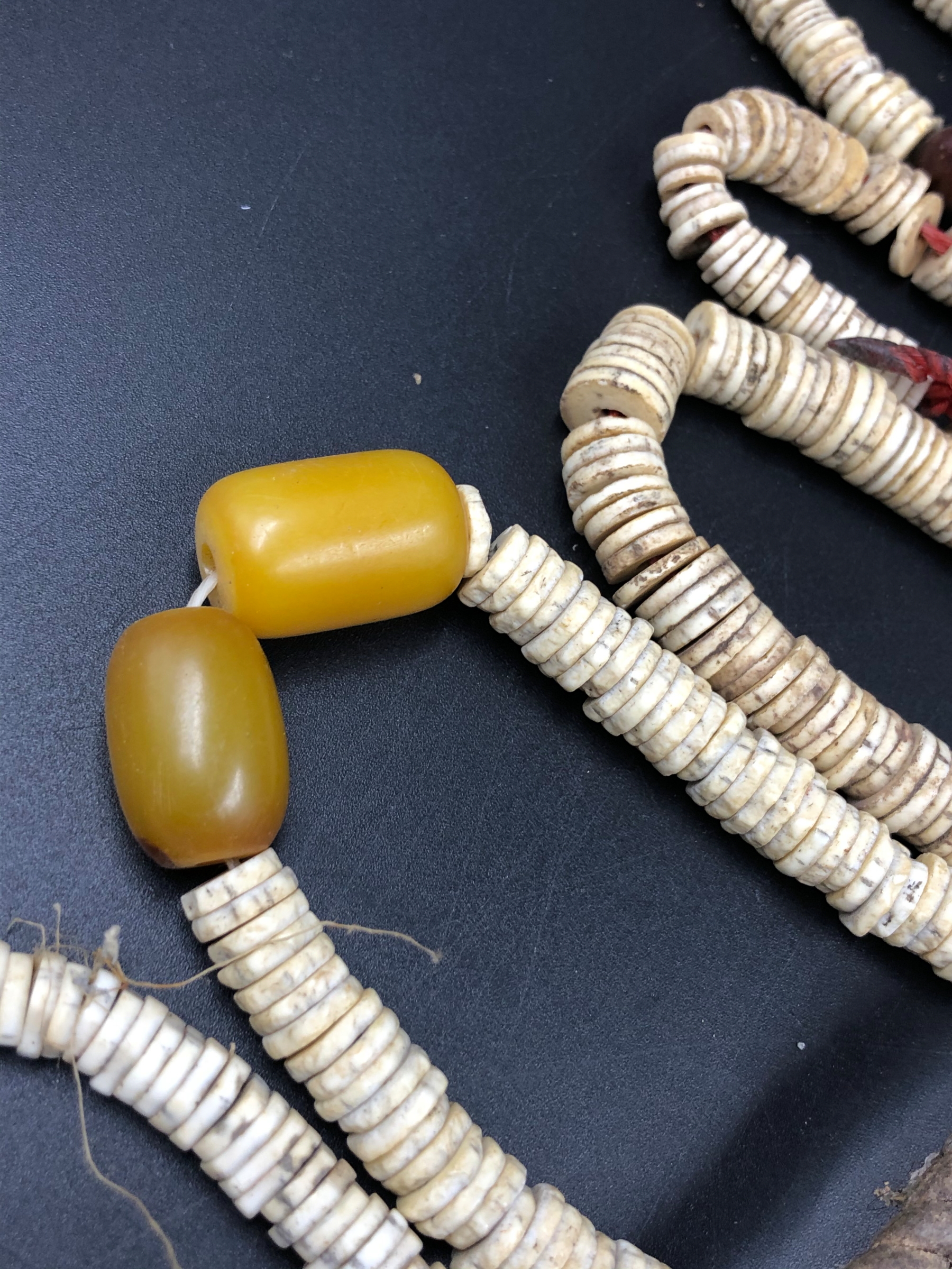 NINE STRANDS OF ETHNIC BEADED NECKLETS TO INCLUDE AMBER, BONE, IRON ETC. - Image 11 of 15