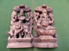 A PAIR OF INDIAN CARVED WOOD NICHES DEPICTING GANESH SEATED ON A DOUBLE LOTUS THRONE AND KRISHNA