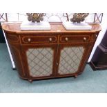 A SHERATON STYLE CROSS BANDED BURR WALNUT SIDE CABINET, THE ROUNDED ENDS FLANKING TWO DRAWERS OVER