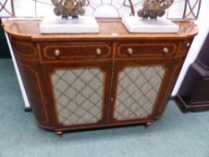 A SHERATON STYLE CROSS BANDED BURR WALNUT SIDE CABINET, THE ROUNDED ENDS FLANKING TWO DRAWERS OVER