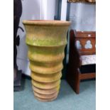 A LARGE TERRACOTTA CYLINDRICAL FORM GARDEN PLANTER WITH RIBBED BANDED DECORATION. H. 92 x Dia.