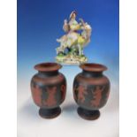 A PAIR OF RED WARE VASES DECORATED IN BLACK WITH A DANCING PROCESSION OF CLASSICAL FIGURES. H 12cms.
