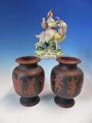 A PAIR OF RED WARE VASES DECORATED IN BLACK WITH A DANCING PROCESSION OF CLASSICAL FIGURES. H 12cms.