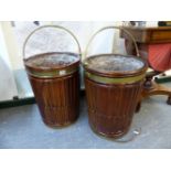 A PAIR OF GEORGIAN STYLE MAHOGANY PEAT BUCKETS OVERSWUNG BY BRASS HANDLES, THE CYLINDRICAL SIDES