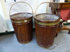 A PAIR OF GEORGIAN STYLE MAHOGANY PEAT BUCKETS OVERSWUNG BY BRASS HANDLES, THE CYLINDRICAL SIDES