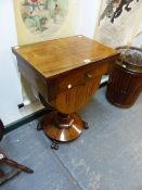 A VICTORIAN ROSEWOOD WORK TABLE, THE RECTANGULAR FLAP TOP OVER A DRAWER AND THE WORK BAG WITHIN
