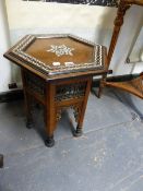 AN ISLAMIC HEXAGONAL TABLE CENTRALLY INLAID WITH MOTHER OF PEARL SIX POINT STAR, THE EBONISED