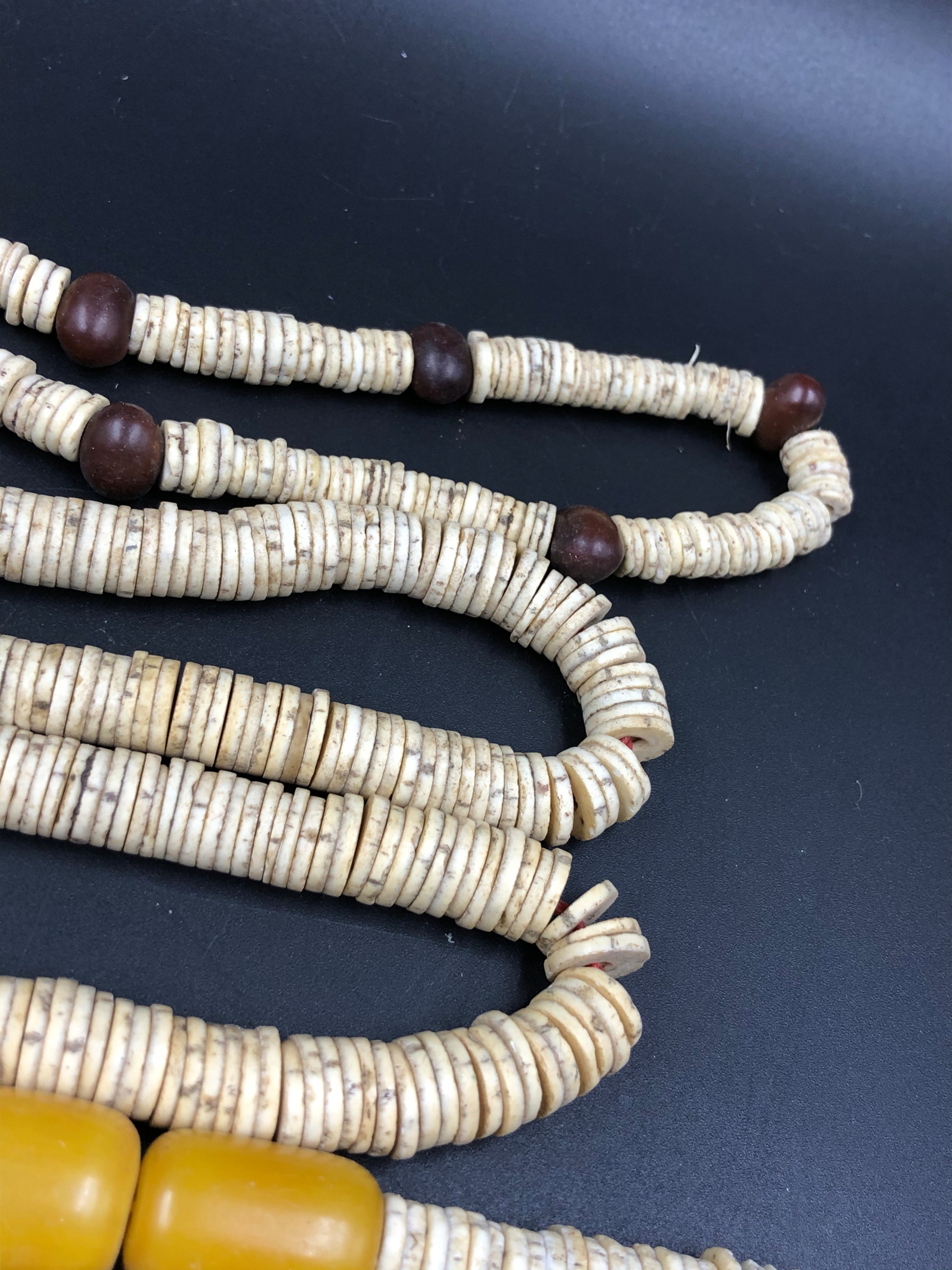 NINE STRANDS OF ETHNIC BEADED NECKLETS TO INCLUDE AMBER, BONE, IRON ETC. - Image 15 of 15