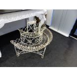 A WIRE WORK THREE TIER DEMILUNE PLANTER SUPPORTED ON THREE FEET. W 97 x D 50 x H 81cms.