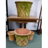 A GROUP OF EIGHT LATTICE DECORATED TERRACOTTA GARDEN PLANTERS OF VARYING SIZES. LARGEST PAIR H. 46 x