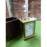 A LEATHER CASED CARRIAGE CLOCK STRIKING ON A COILED ROD. H 15cms.