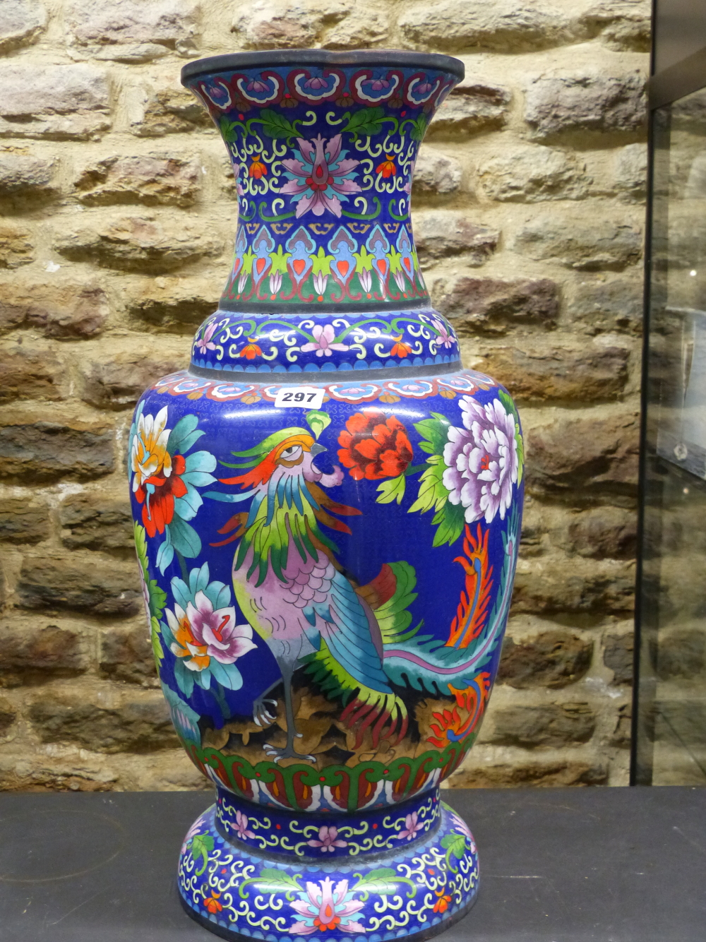 A CHINESE CLOISONNE ENAMEL BALUSTER VASE WORKED WITH TWO PHOENIX AMONGST PEONIES ON A DEEP BLUE