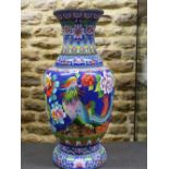 A CHINESE CLOISONNE ENAMEL BALUSTER VASE WORKED WITH TWO PHOENIX AMONGST PEONIES ON A DEEP BLUE