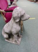 A PAIR OF COMPOSITE STONE FIGURES OF SEATED LABRADORS. H 71cms.