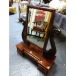 AN EARLY VICTORIAN MAHOGANY DRESSING TABLE MIRROR, THE RECTANGULAR PLATE SUPPORTED BETWEEN S-