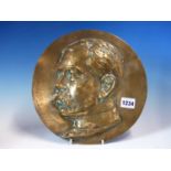 A BRONZE ROUNDEL WITH THE HEAD OF A MOUSTACHIOED MAN IN RELIEF, POSSIBLY LORD KITCHENER. Dia. 26.