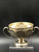 A HALLMARKED SILVER TWO HANDLED FOOTED BOWL, DATED 1907 EDINBURGH FOR HAMILTON & INCHES. HEIGHT