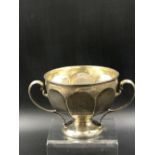 A HALLMARKED SILVER TWO HANDLED FOOTED BOWL, DATED 1907 EDINBURGH FOR HAMILTON & INCHES. HEIGHT