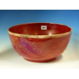 A RED LUSTRE POTTERY BOWL, THE EXTERIOR DECORATION OF SAZ LEAVES AND FLOWERS PARTIALLY SMOKED IN THE