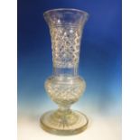 A CLEAR GLASS THISTLE SHAPED VASE CUT WITH DIAMOND DIAPER AND ON STAR CUT CIRCULAR FOOT. H 43cms.