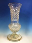 A CLEAR GLASS THISTLE SHAPED VASE CUT WITH DIAMOND DIAPER AND ON STAR CUT CIRCULAR FOOT. H 43cms.