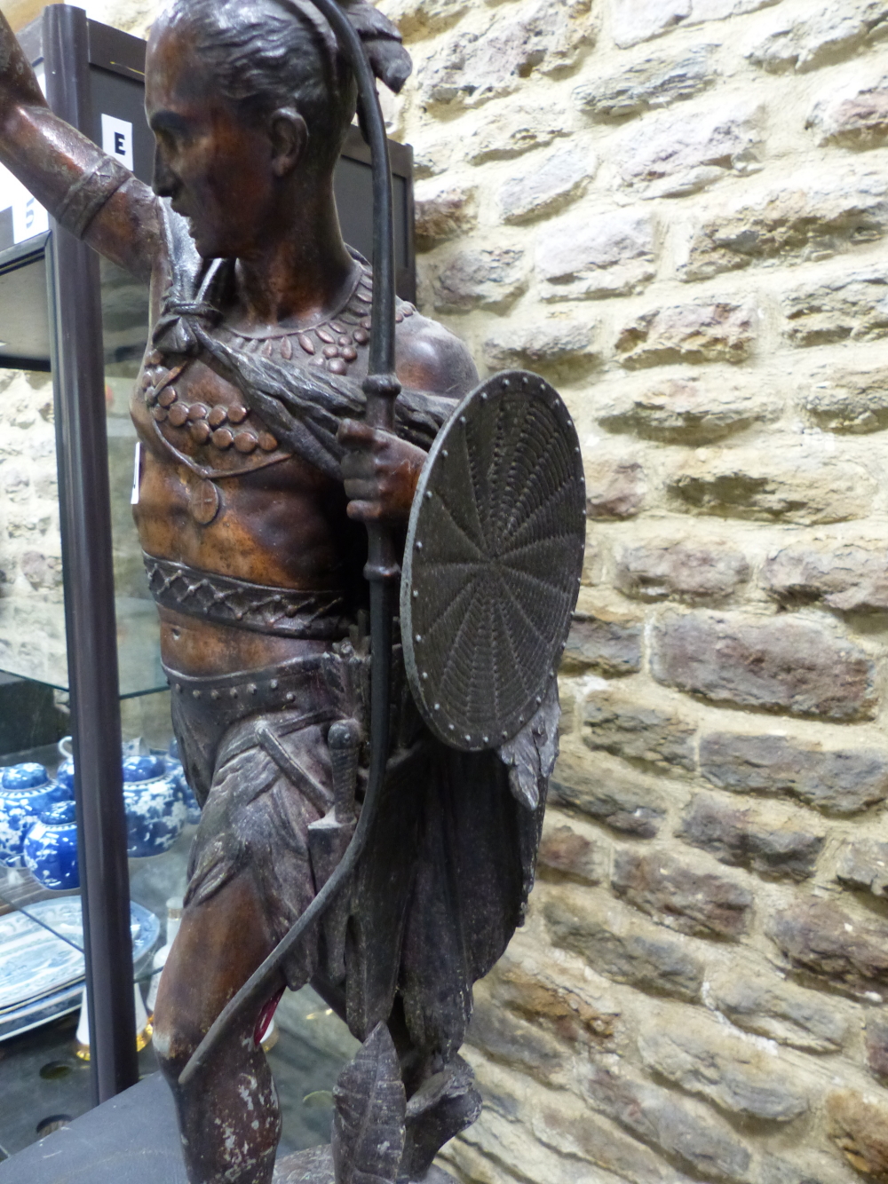 A SPELTER FIGURAL LAMP CAST AS AN AMERICAN INDIAN WITH BOW AND SHIELD IN HIS LEFT HAND WHILE THE - Image 6 of 9