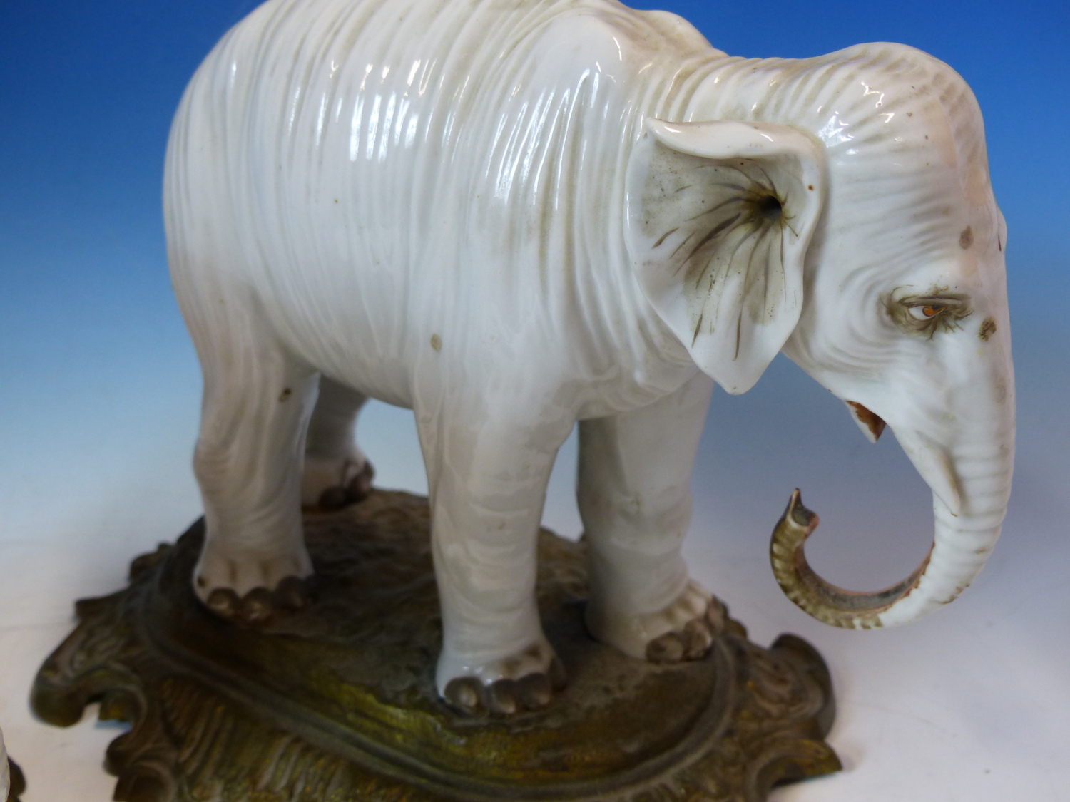 A PAIR OF ANTIQUE GERMAN PORCELAIN ELEPHANTS STANDING ON LATER ORMOLU BASES. W 26cms. - Image 6 of 8