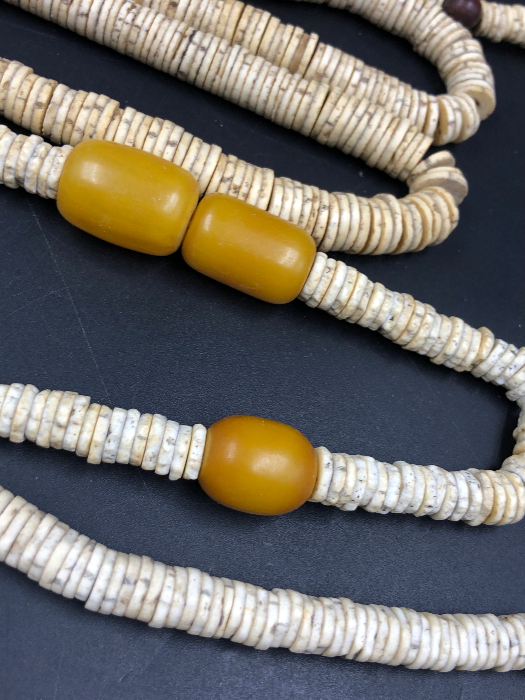 NINE STRANDS OF ETHNIC BEADED NECKLETS TO INCLUDE AMBER, BONE, IRON ETC. - Image 7 of 15