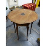 AN ARTS AND CRAFTS MAHOGANY TABLE THE WAVY EDGED CIRCULAR TOP WITH CENTRAL EBONISED FLOWER HEAD, THE