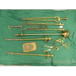 A COLLECTION OF SIX VARIOUS FIRE IRONS.A STAND AND THREE PAIRS OF BRASS EMBER TONGS