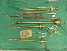 A COLLECTION OF SIX VARIOUS FIRE IRONS.A STAND AND THREE PAIRS OF BRASS EMBER TONGS