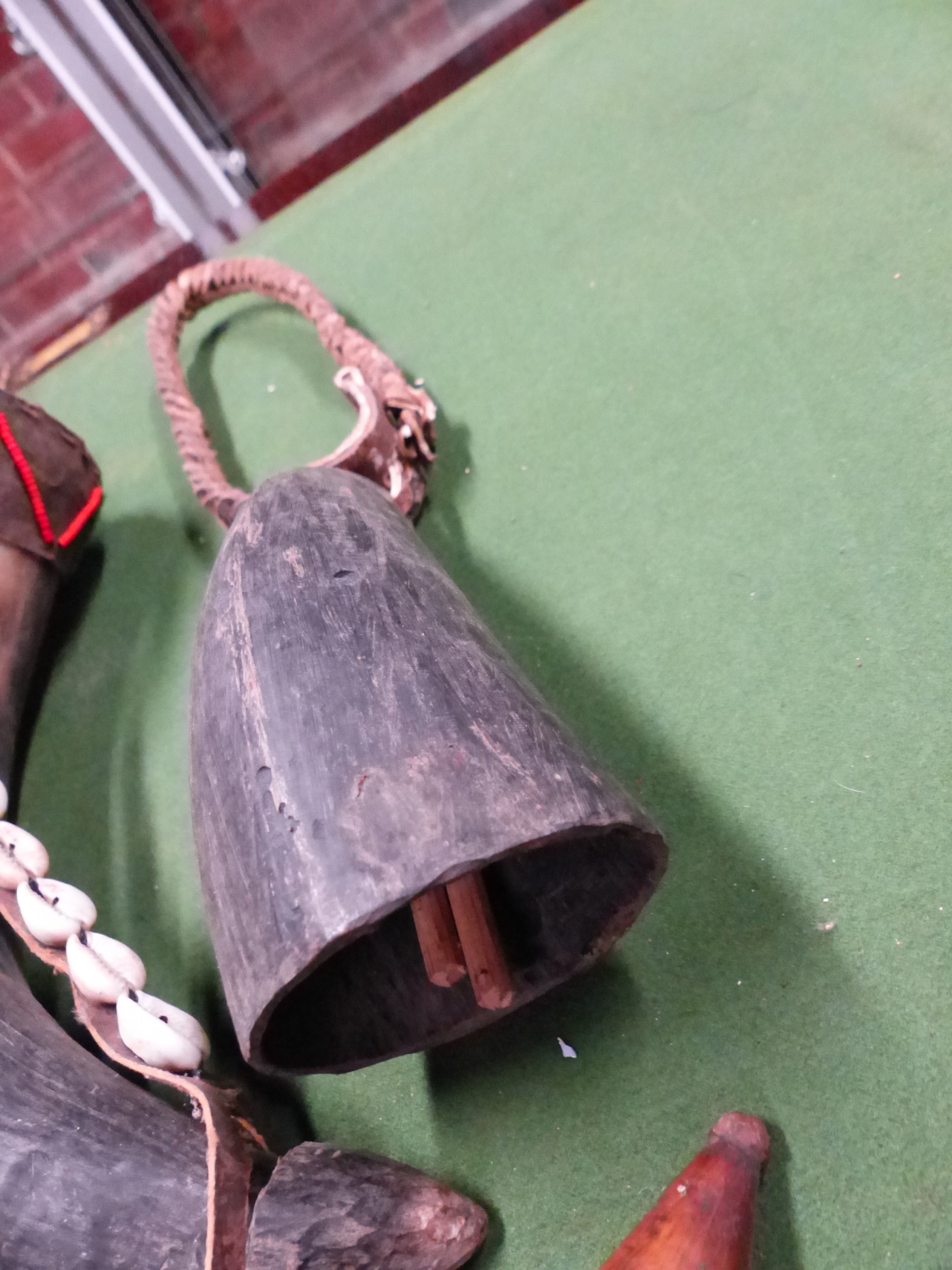 THREE COWRIE DECORATED COWS HORNS, ANOTHER UNDECORATED,A COWS HORN BELL TOGETHER WITH THREE IRON COW - Image 3 of 4